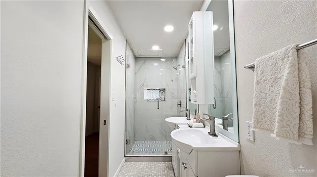 a bathroom with a sink tub and a mirror