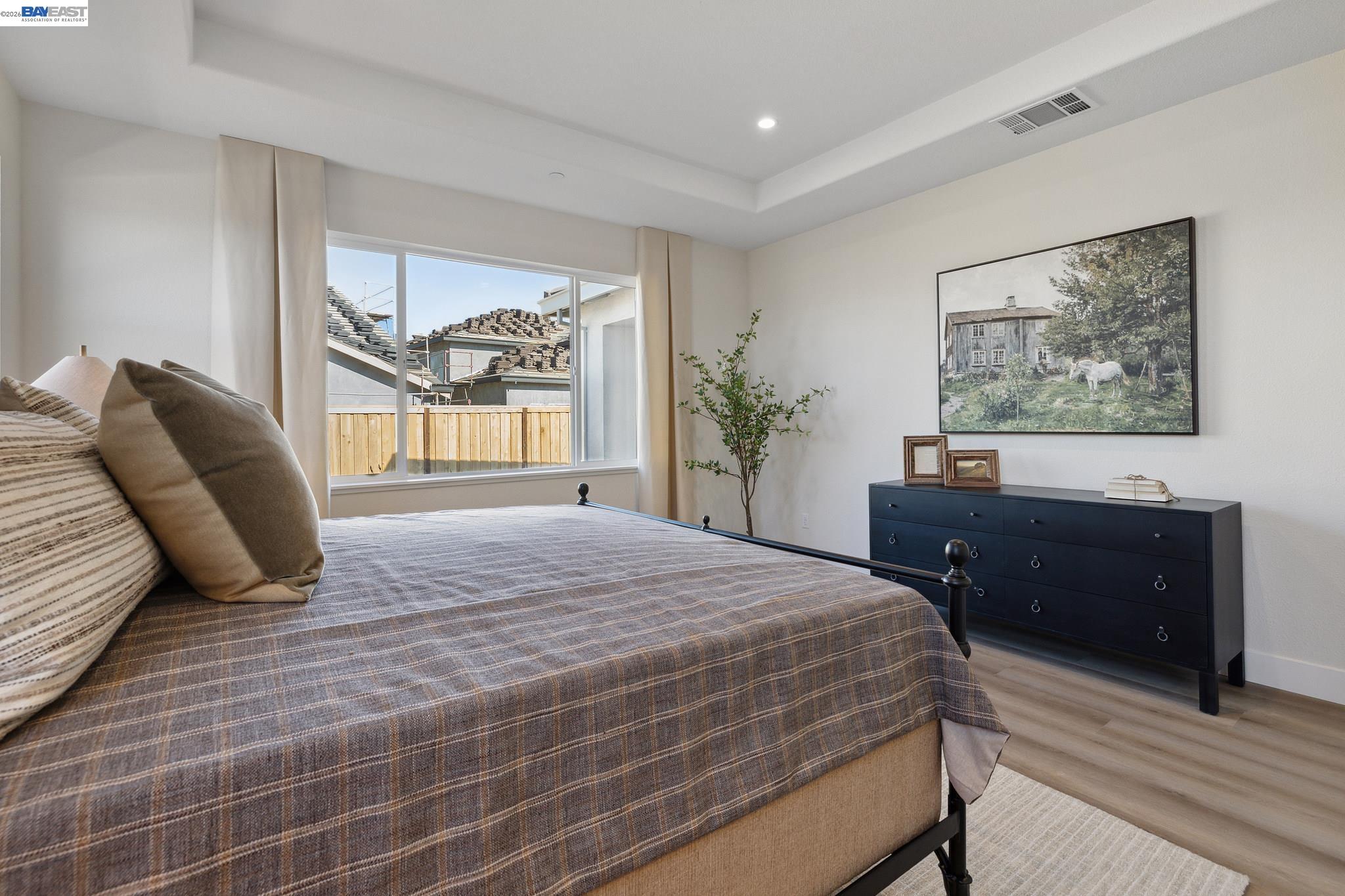 1504 Millennium Way Fairfield, CA 94533 - Photo 21 of 38 a bedroom with a bed and a large mirror with wooden floor