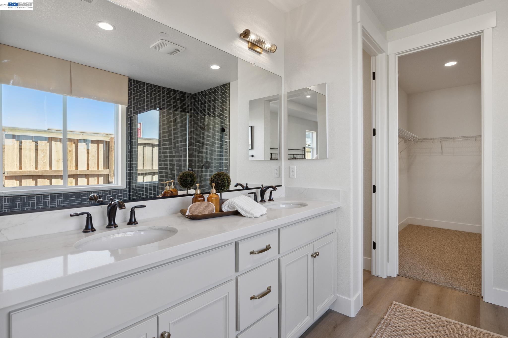 1504 Millennium Way Fairfield, CA 94533 - Photo 23 of 38 a bathroom with double sink and a mirror