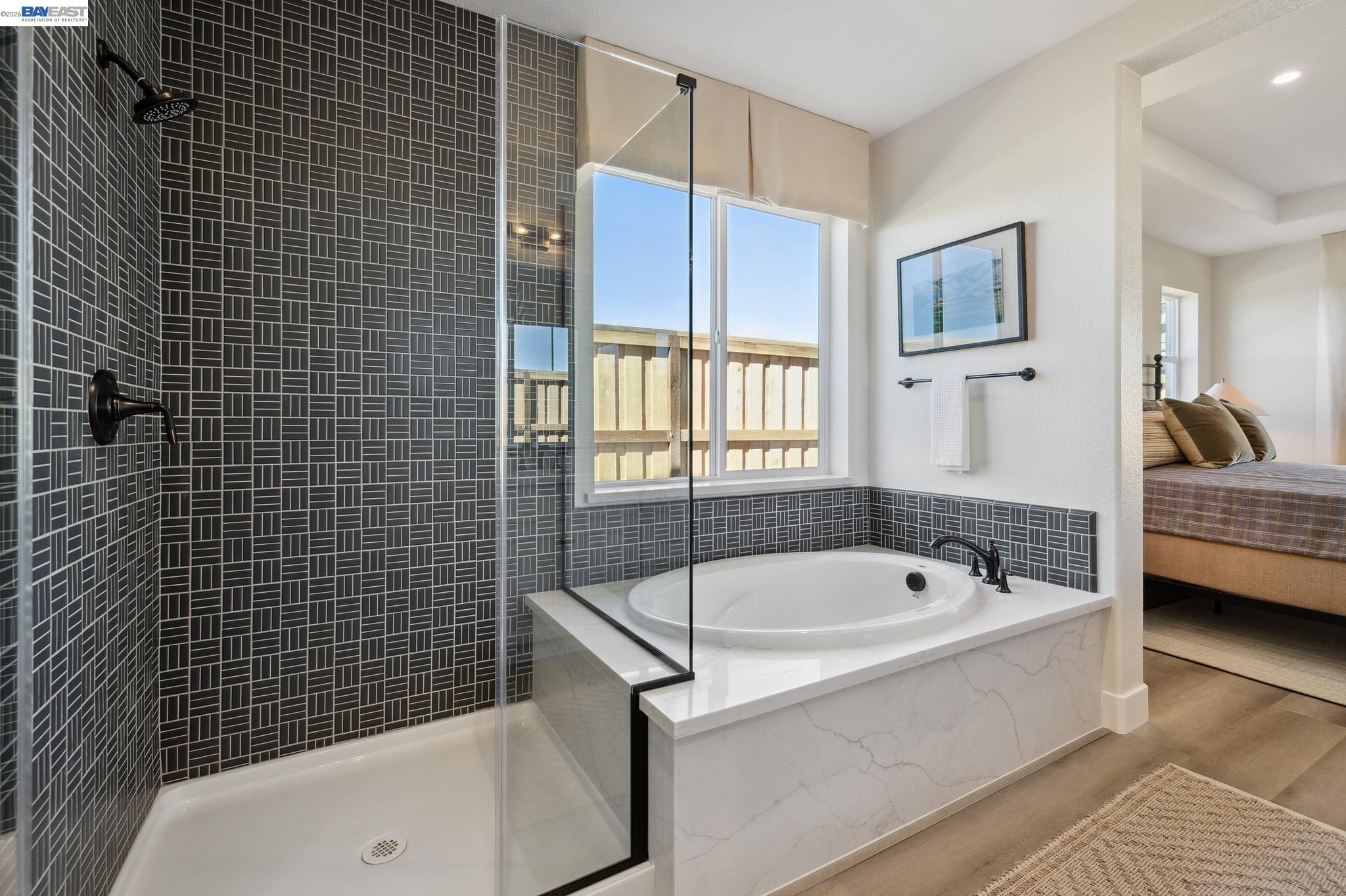 1504 Millennium Way Fairfield, CA 94533 - Photo 26 of 38 a bathroom with a tub a window and walk in closet