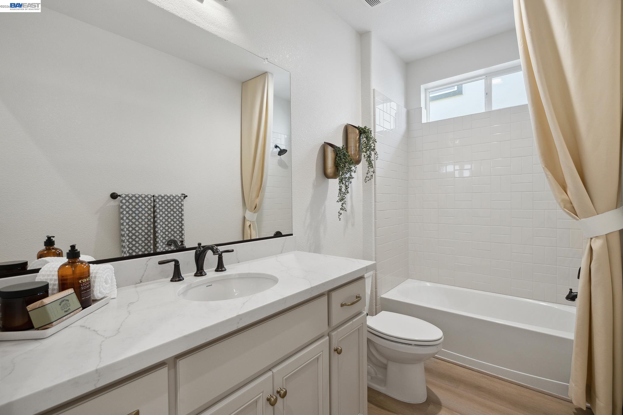 1504 Millennium Way Fairfield, CA 94533 - Photo 33 of 38 a bathroom with a sink a toilet and shower