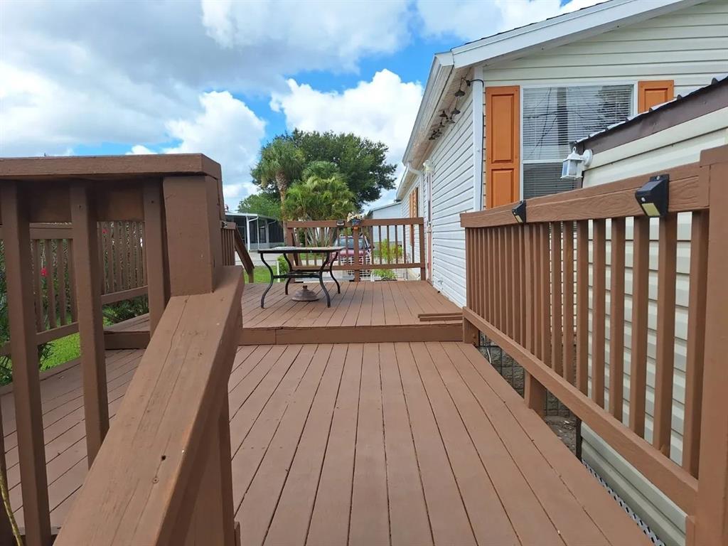6200 99th Sebastian, FL 32958 - Photo 4 of 5 a view of balcony with furniture and wooden deck
