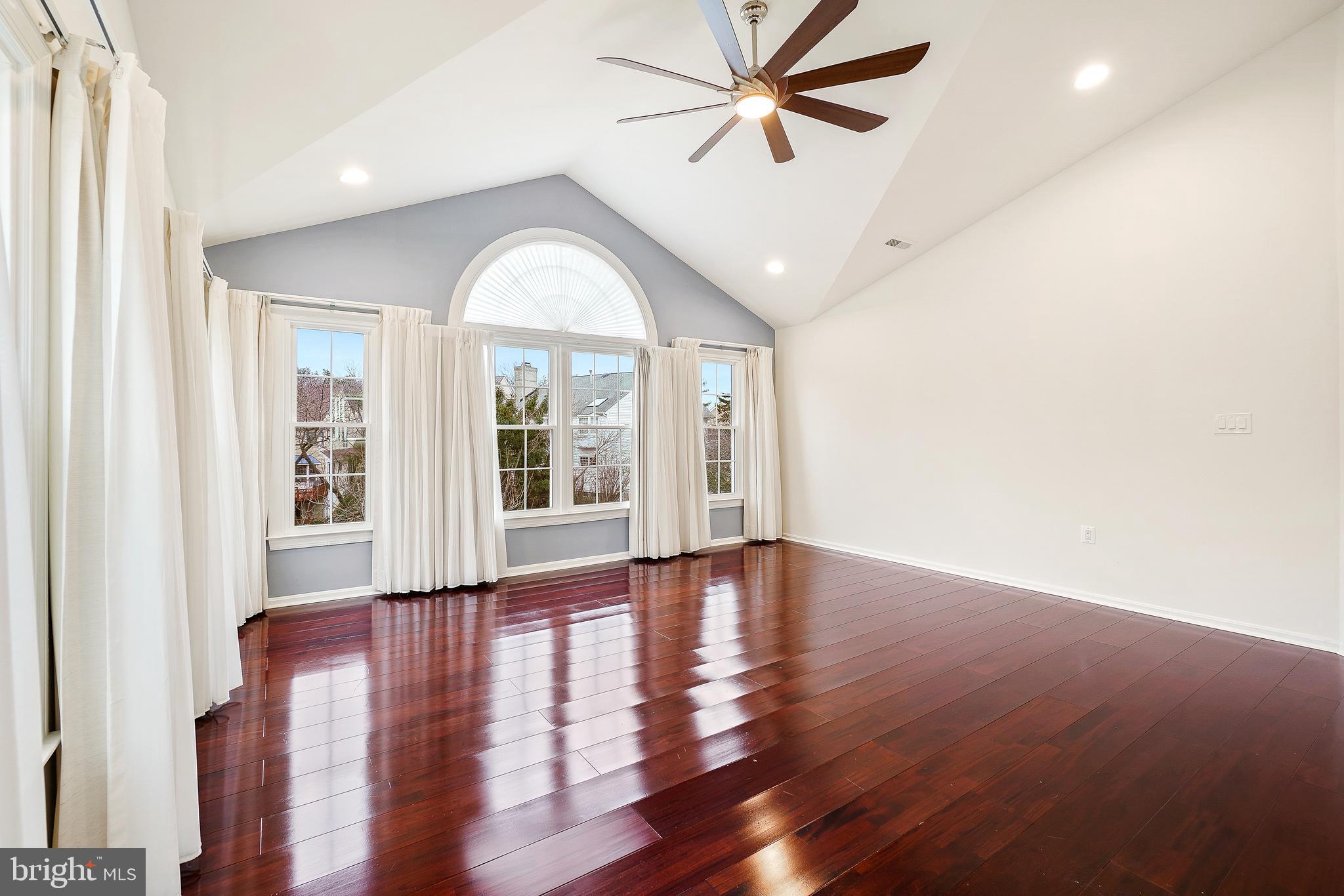 315 Argosy Drive Gaithersburg, MD 20878 - Photo 25 of 48 an empty room with wooden floor fan and windows