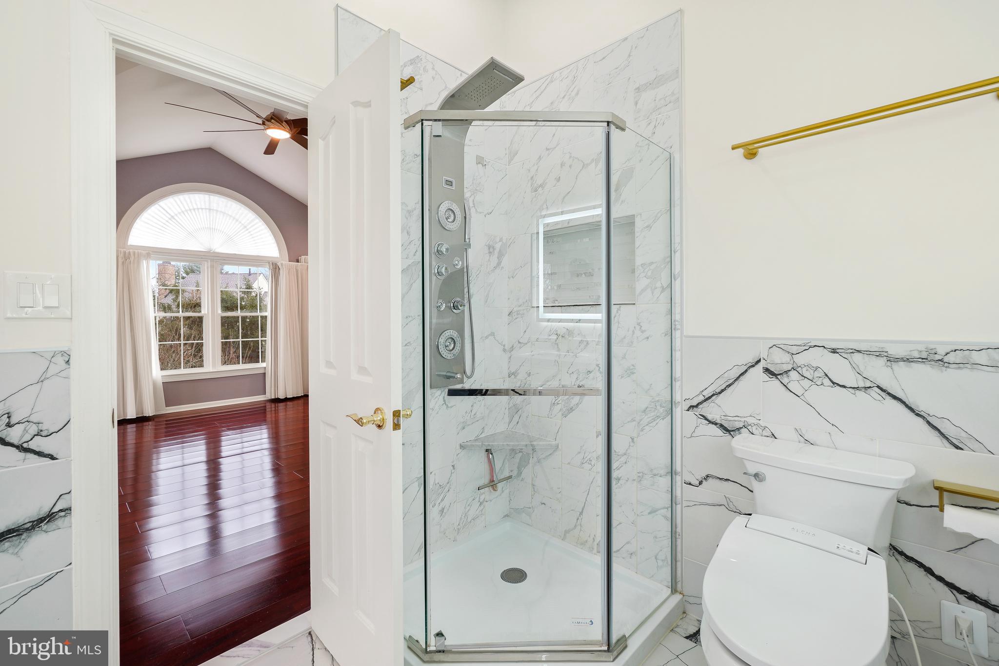 315 Argosy Drive Gaithersburg, MD 20878 - Photo 29 of 48 a bathroom with a shower a toilet and a sink