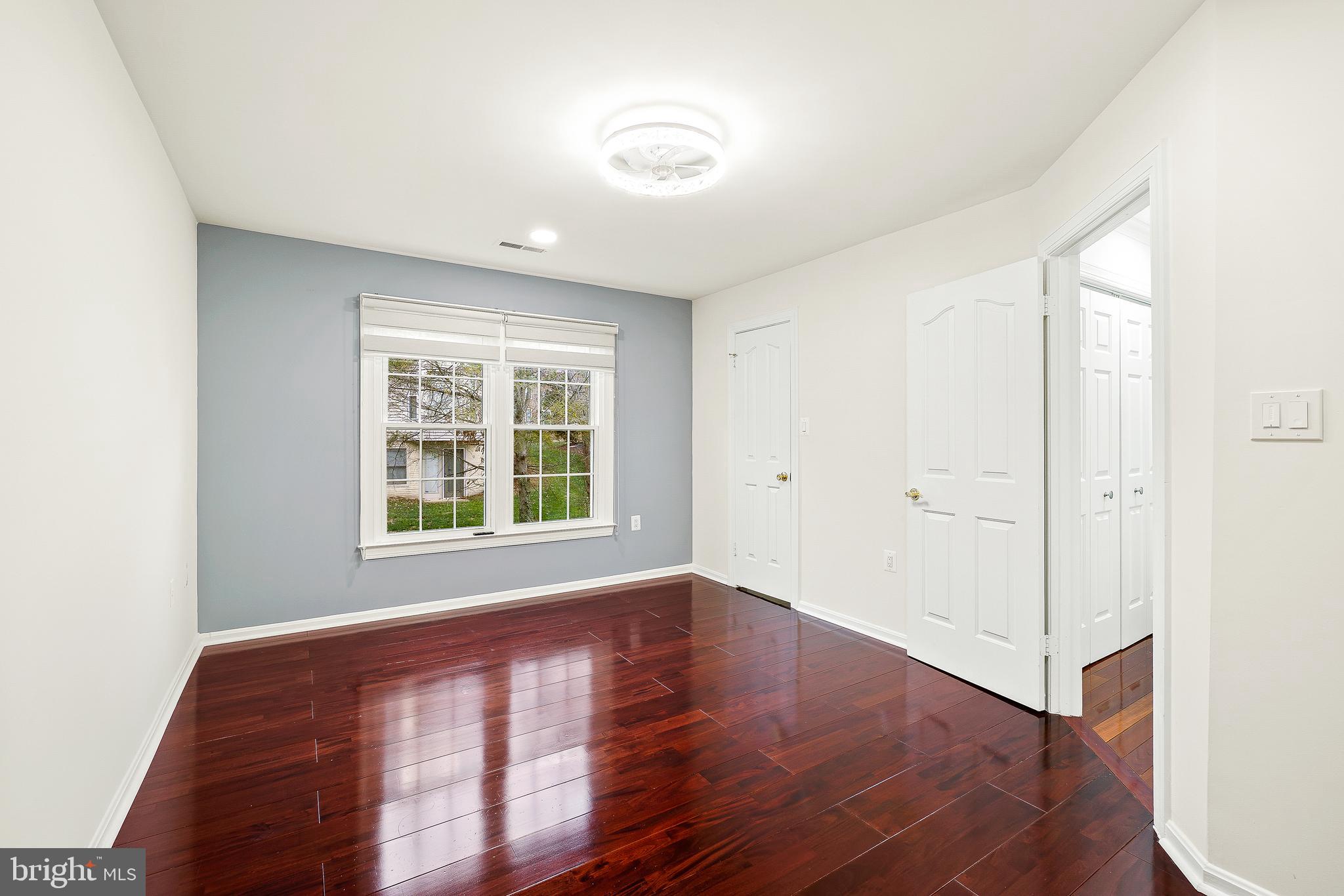 315 Argosy Drive Gaithersburg, MD 20878 - Photo 31 of 48 a view of an empty room with wooden floor and a window