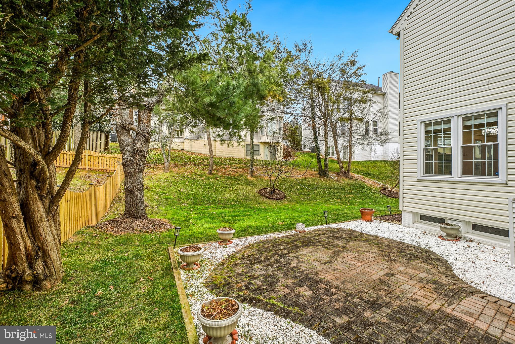 315 Argosy Drive Gaithersburg, MD 20878 - Photo 45 of 48 a view of a backyard with tree s