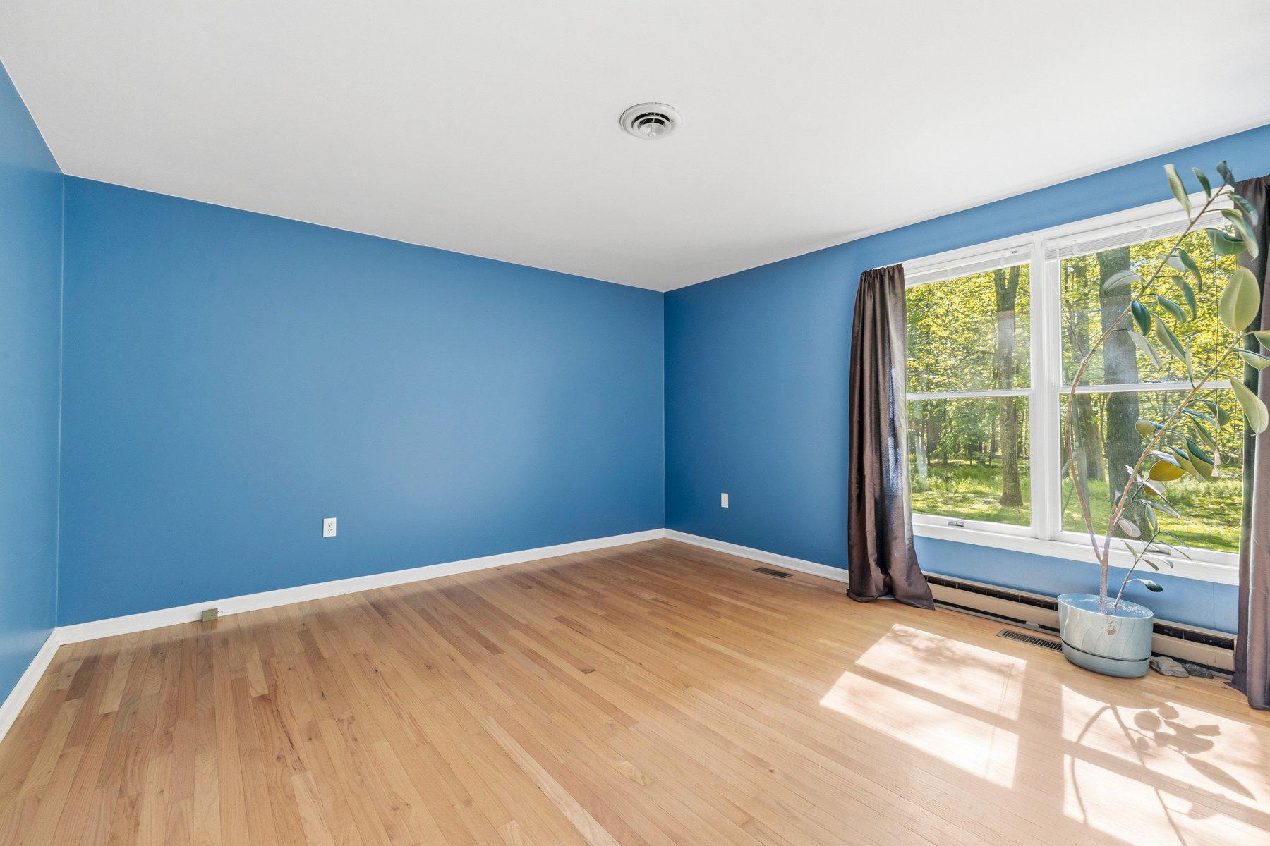 10820 Gambrill Park Road Frederick, MD 21702 - Photo 20 of 35 Primary bedroom with window view to wooded yard!