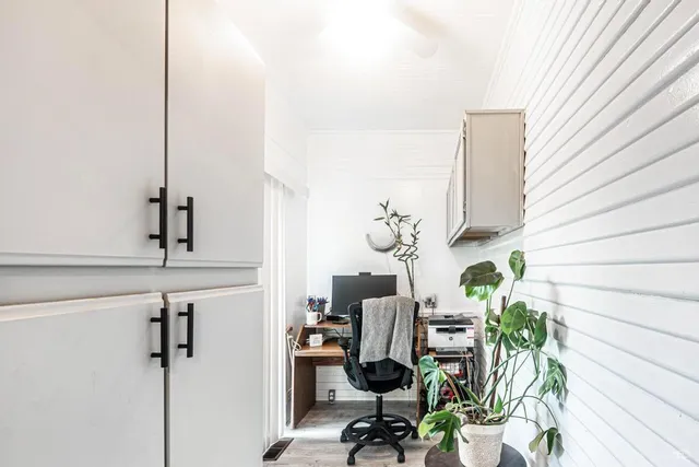 a view of a workspace with furniture