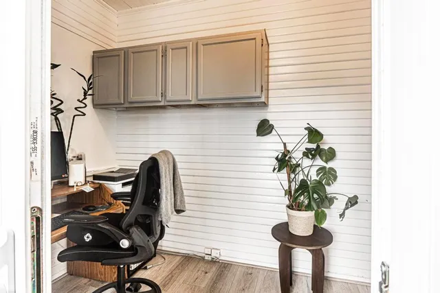a dining room with furniture and wooden floor