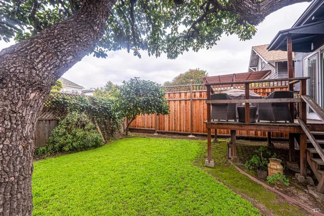 a view of a chairs and bench in the yard