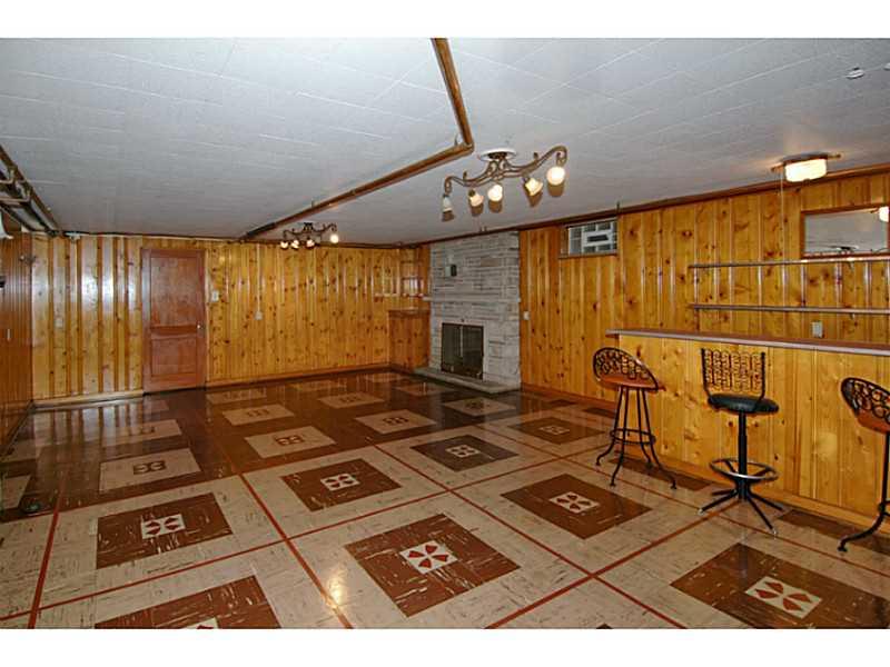 72 Coraopolis Road Coraopolis, PA 15108 - Photo 14 of 25 Basement/Game Room. Spacious Game room with Knotty Pine paneling, wet bar and stone fireplace.