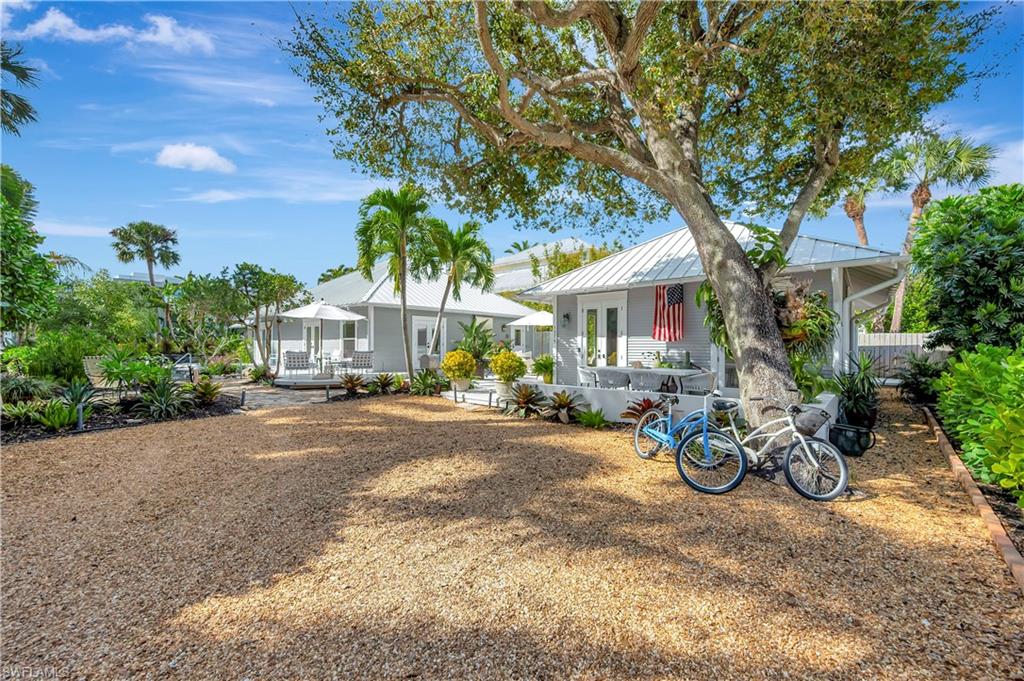 1375 Gordon Drive Naples, FL 34102 - Photo 2 of 37 Driveway/Side Entrance