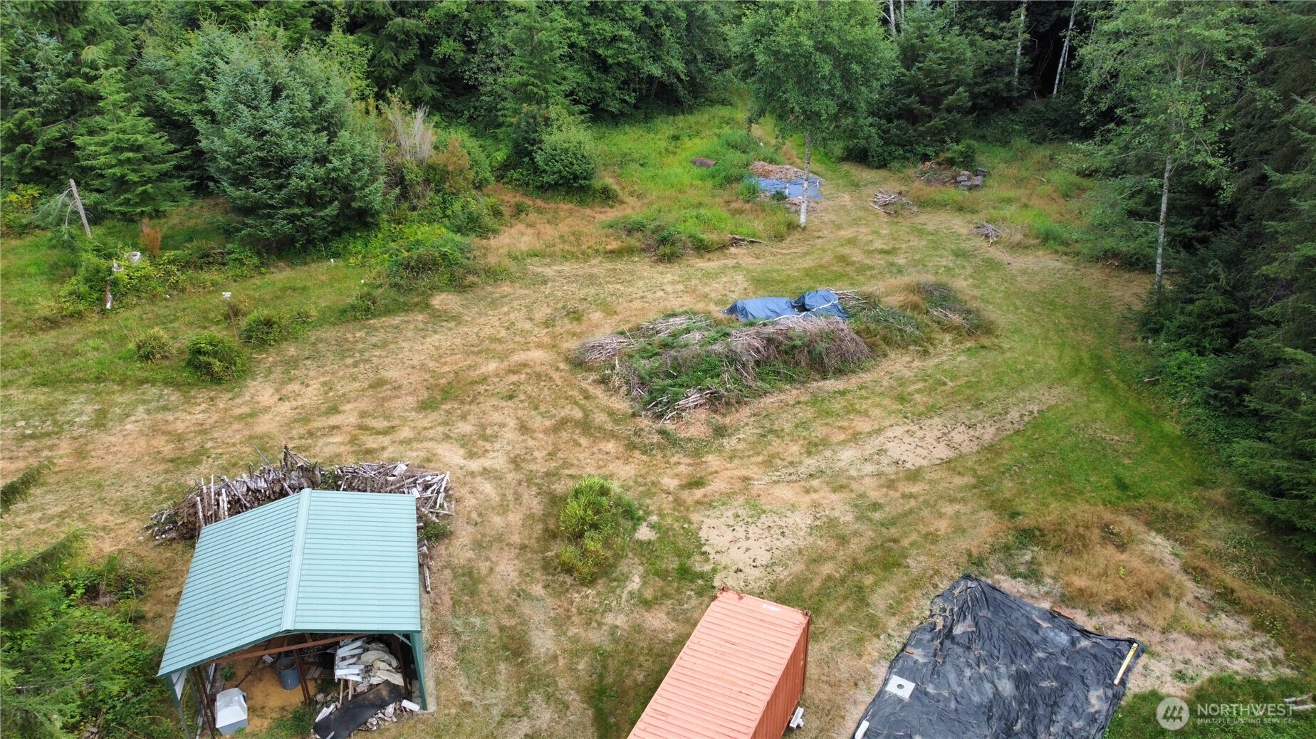 1608 East Hoquiam Road Hoquiam, WA 98550 - Photo 4 of 18 a backyard of a house with a yard and outdoor seating