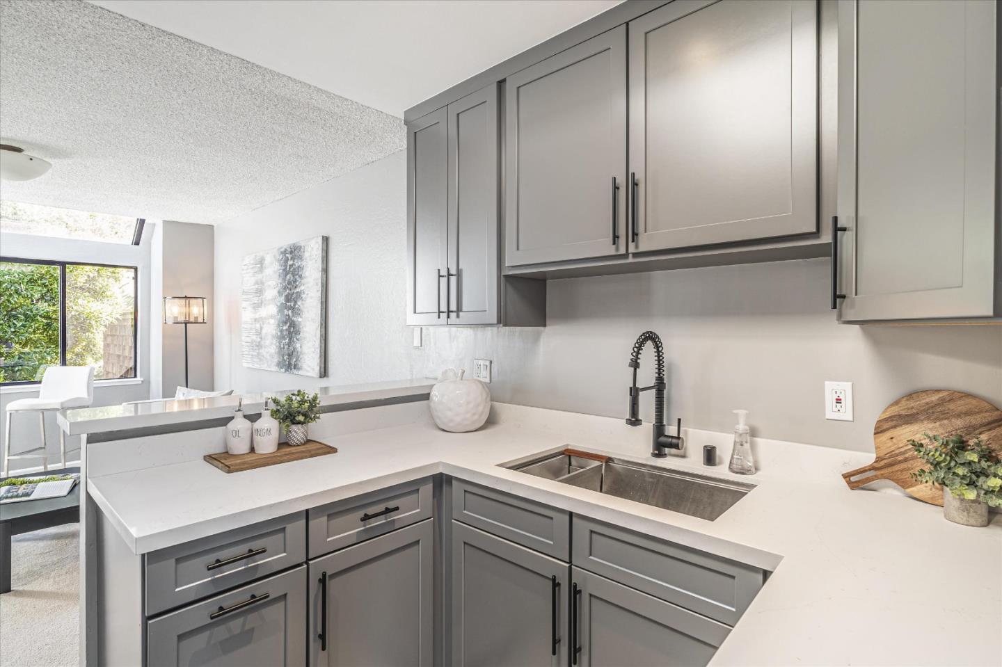 290 Beachview Avenue, Unit 39 Pacifica, CA 94044 - Photo 21 of 63 a kitchen with stainless steel appliances granite countertop a sink a stove and cabinets