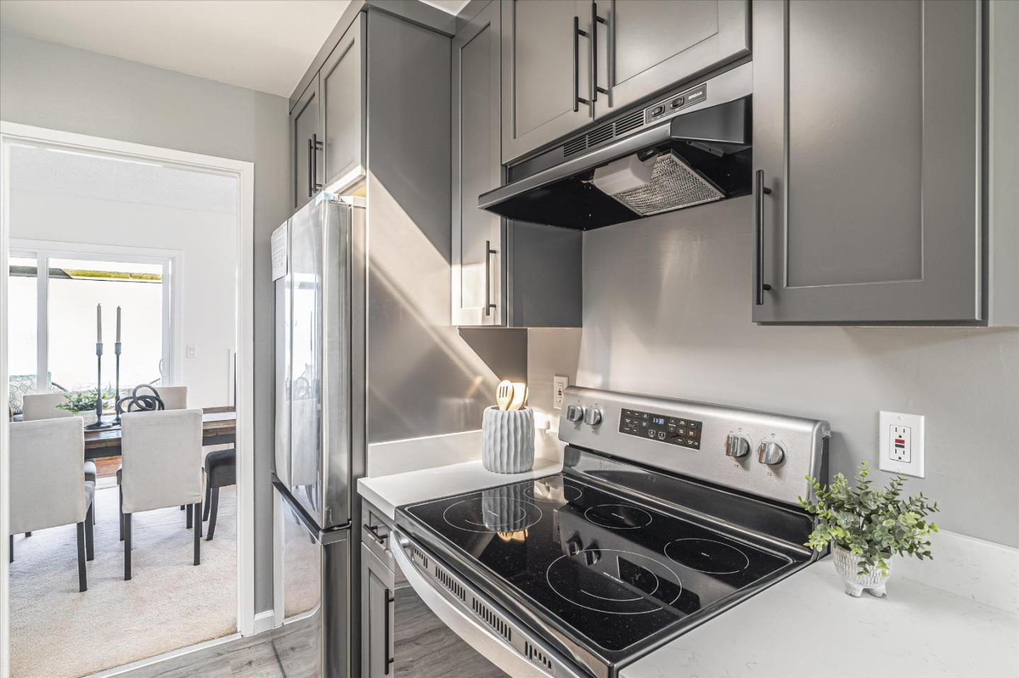 290 Beachview Avenue, Unit 39 Pacifica, CA 94044 - Photo 23 of 63 a kitchen with stainless steel appliances granite countertop a stove and a cabinets