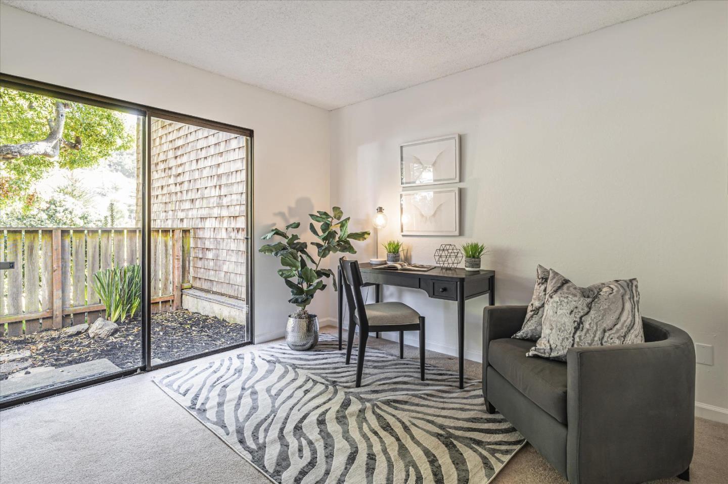 290 Beachview Avenue, Unit 39 Pacifica, CA 94044 - Photo 30 of 63 a living room with furniture and a table
