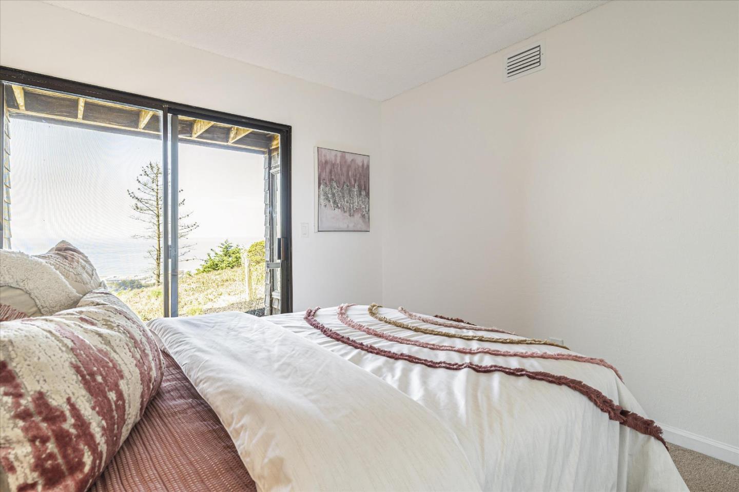 290 Beachview Avenue, Unit 39 Pacifica, CA 94044 - Photo 32 of 63 a bedroom with a bed and a window