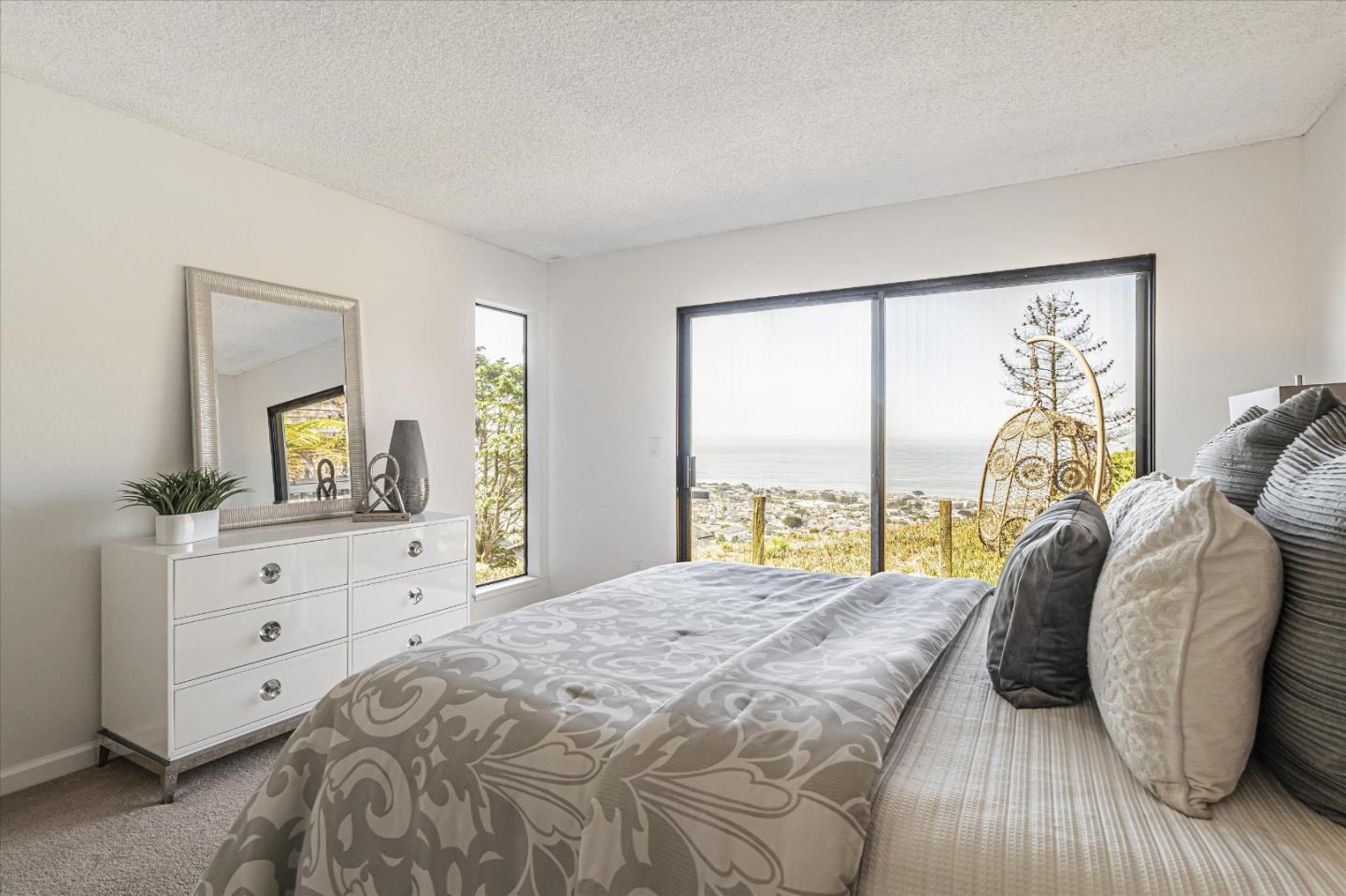 290 Beachview Avenue, Unit 39 Pacifica, CA 94044 - Photo 34 of 63 a bedroom with a bed and a dresser