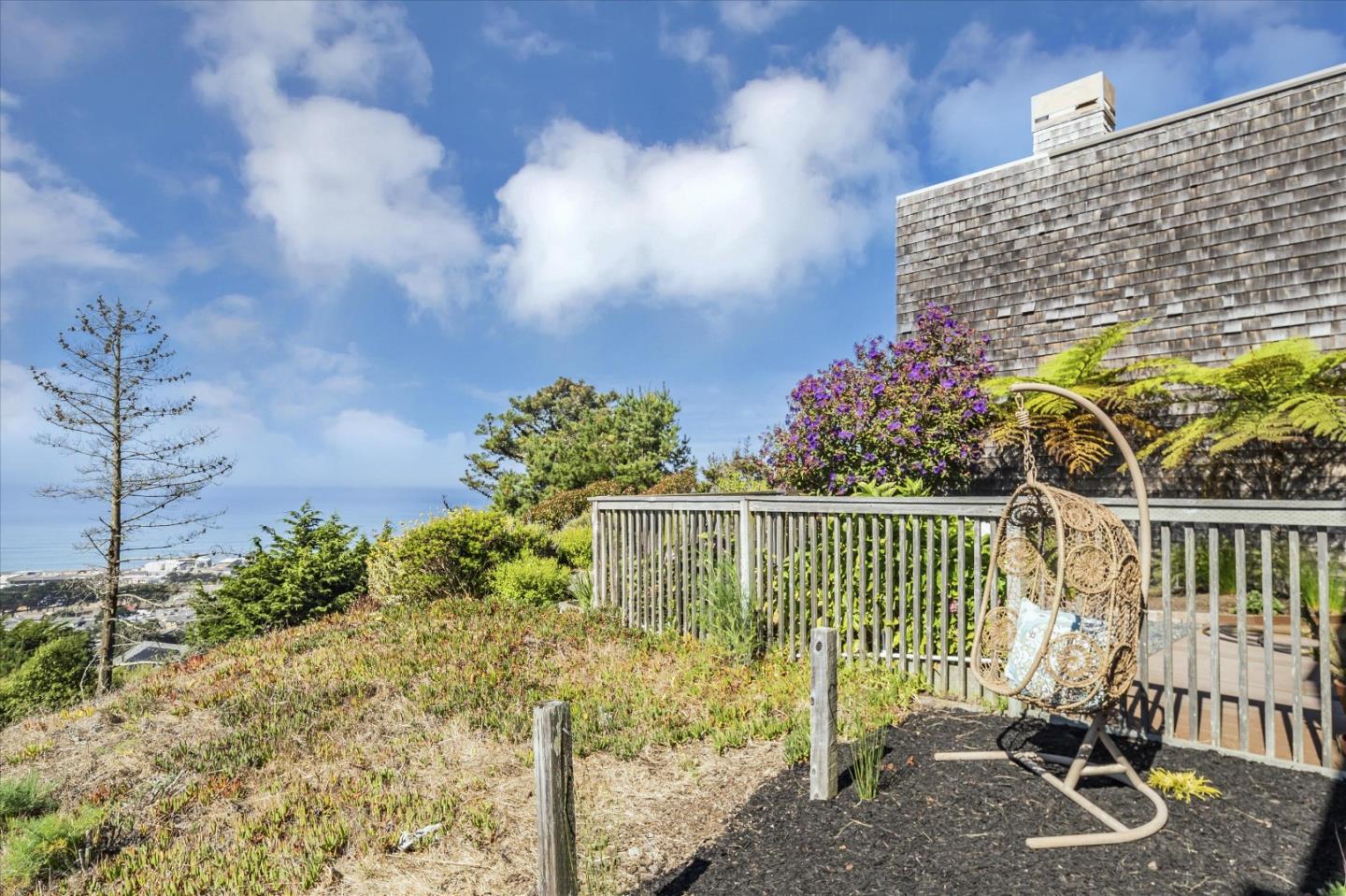 290 Beachview Avenue, Unit 39 Pacifica, CA 94044 - Photo 39 of 63 a view of a chair and table in the backyard
