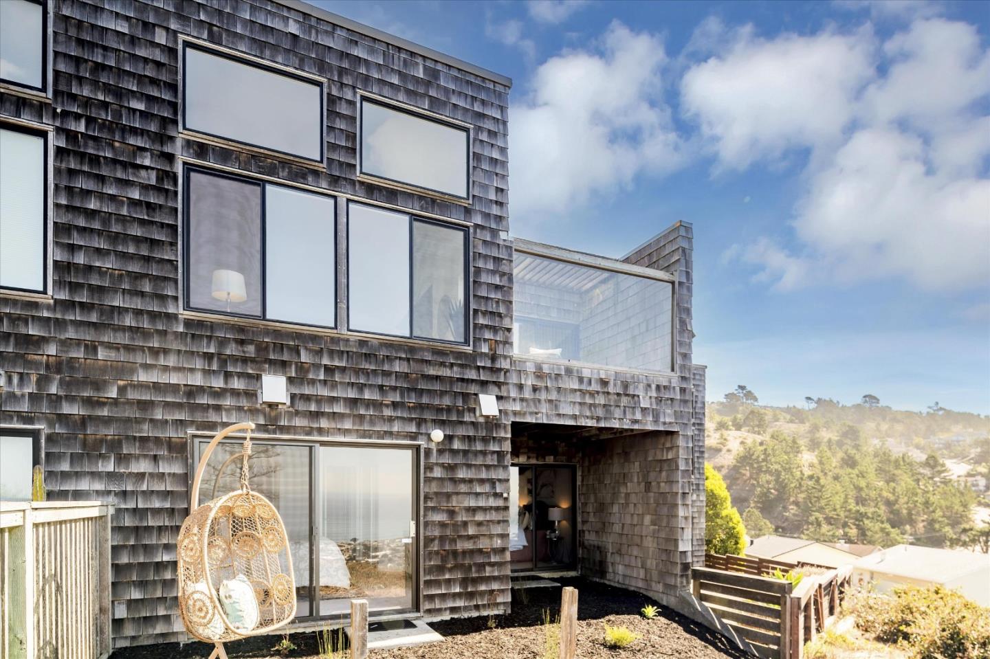 290 Beachview Avenue, Unit 39 Pacifica, CA 94044 - Photo 43 of 63 a front view of a house with large windows