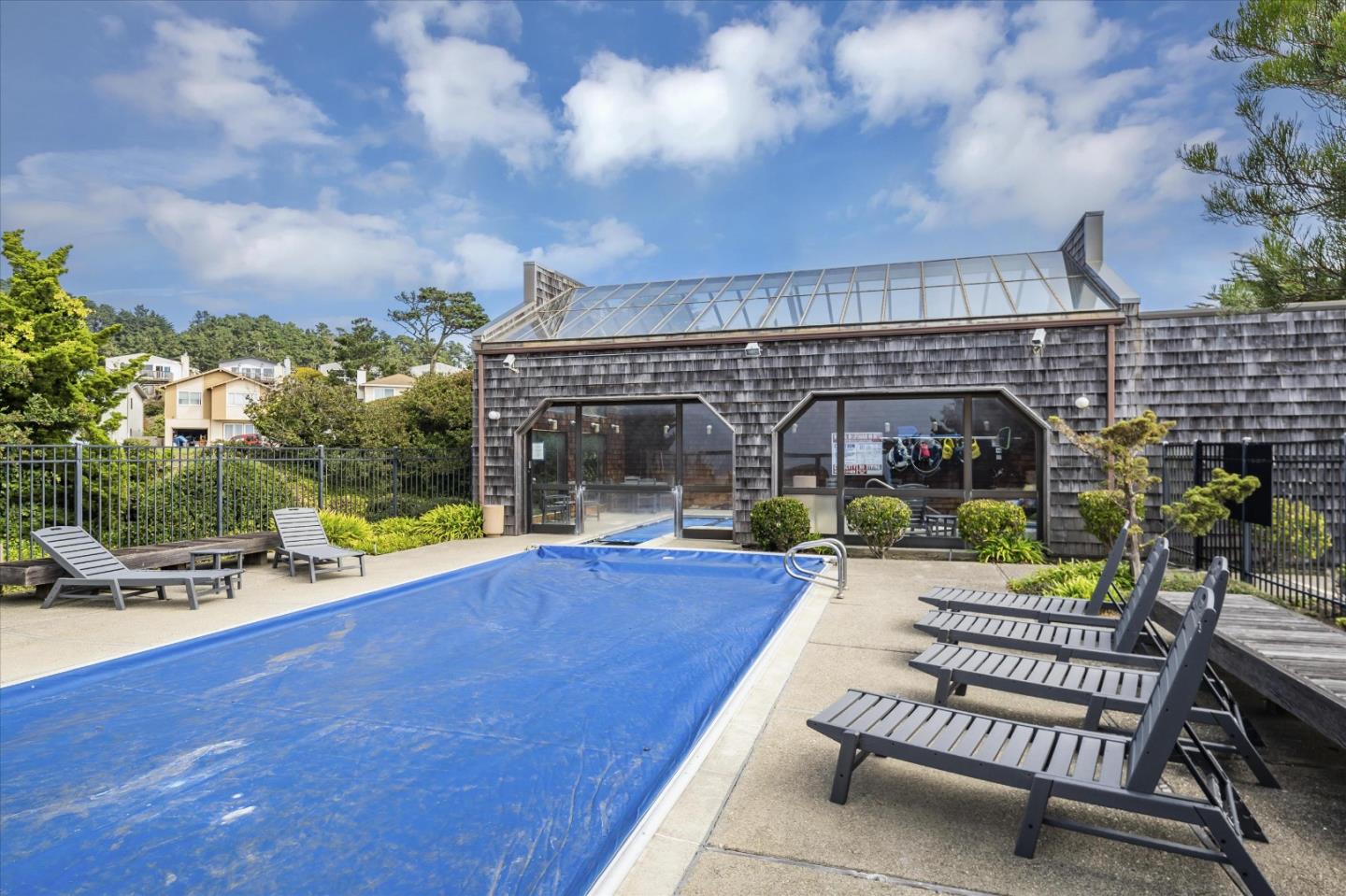 290 Beachview Avenue, Unit 39 Pacifica, CA 94044 - Photo 55 of 63 a view of swimming pool with seating space and wooden fence