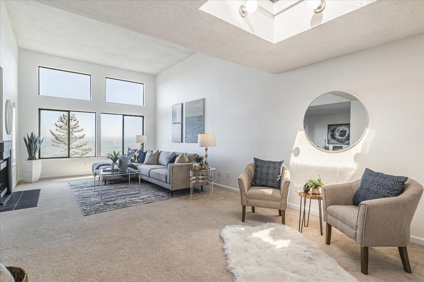 290 Beachview Avenue, Unit 39 Pacifica, CA 94044 - Photo 10 of 63 a living room with furniture and a large window