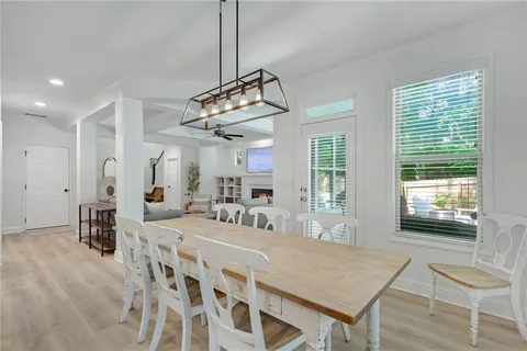 a very nice looking dining room with a table and chairs