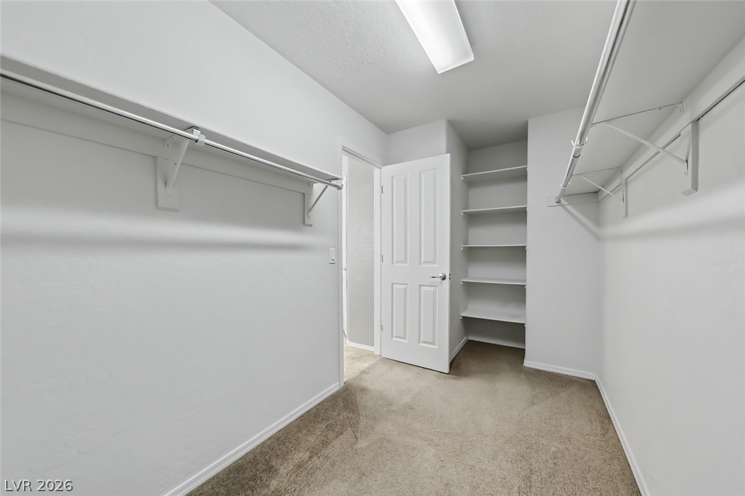 2356 Rue Bienville Way Henderson, NV 89044 - Photo 12 of 20 This spacious walk-in closet offers ample storage with built-in shelving and convenient hanging rods.