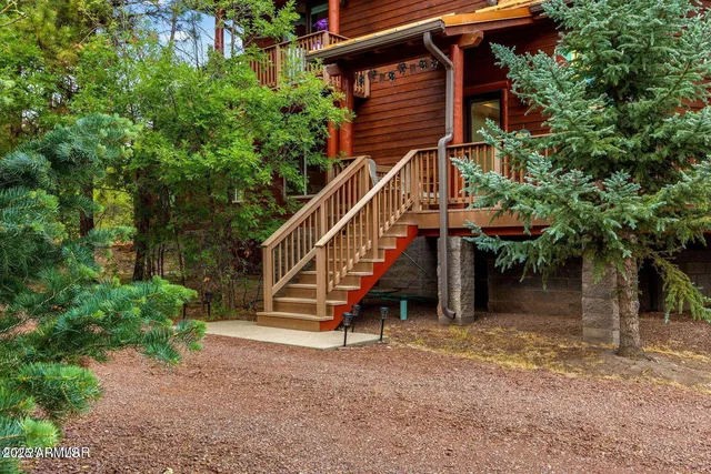 a view of front door and deck of house