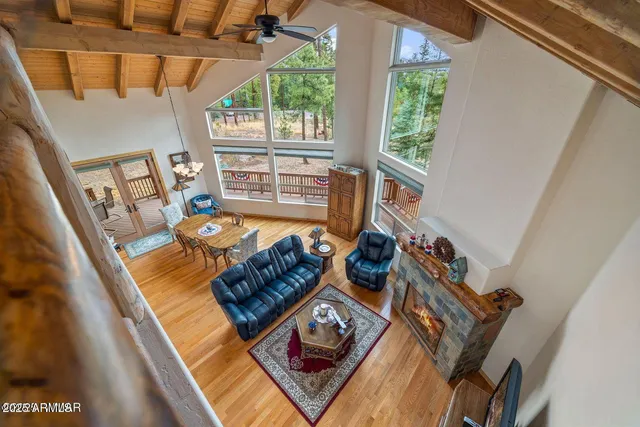 a living room with a bed furniture and a window