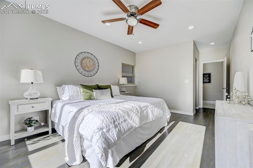 2326 Condor Street Colorado Springs, CO 80909 - Photo 17 of 47 a bedroom with a bed and ceiling fan