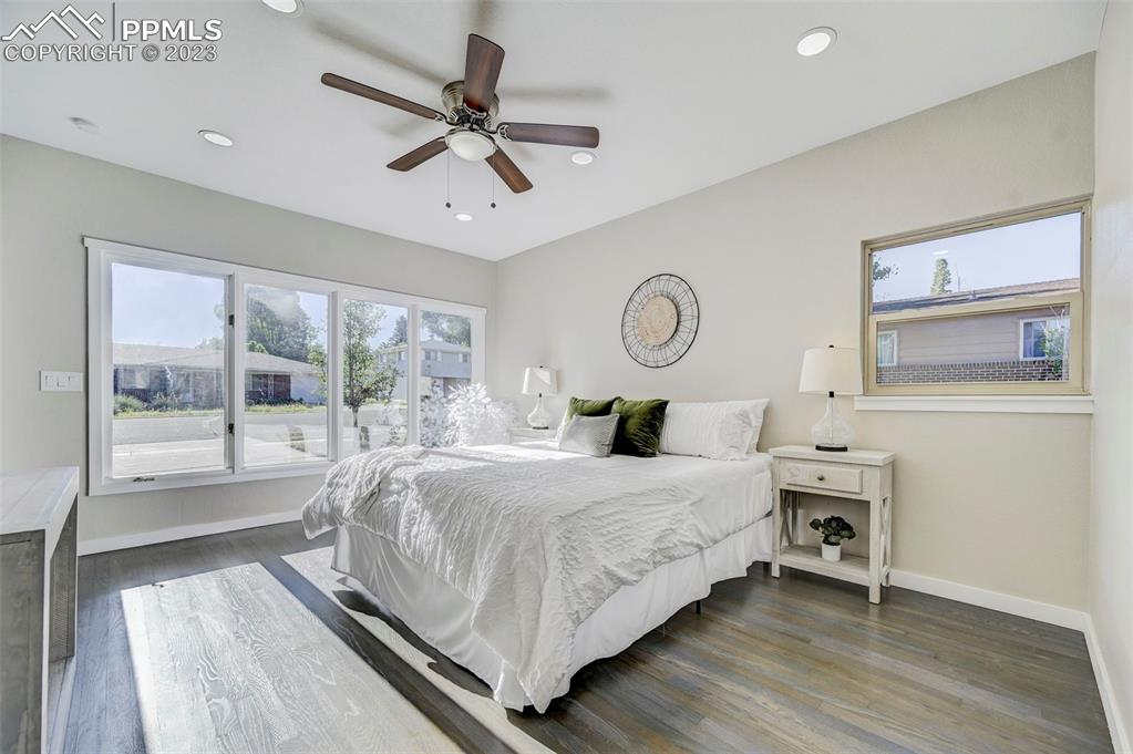 2326 Condor Street Colorado Springs, CO 80909 - Photo 18 of 47 a bedroom with a large bed and a large window