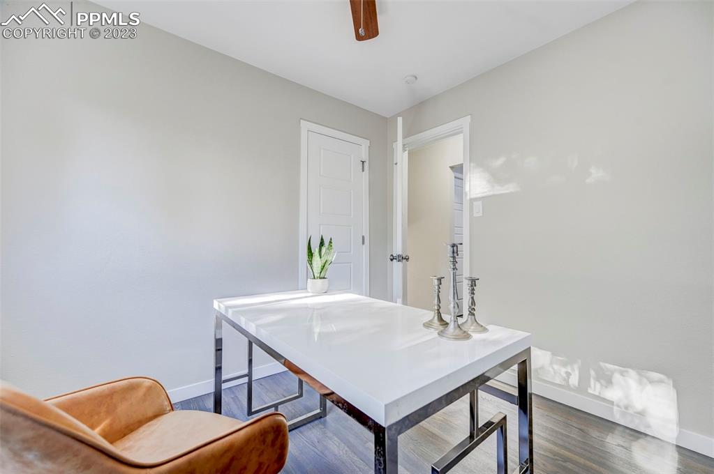 2326 Condor Street Colorado Springs, CO 80909 - Photo 24 of 47 a view of a room with furniture and wooden floor