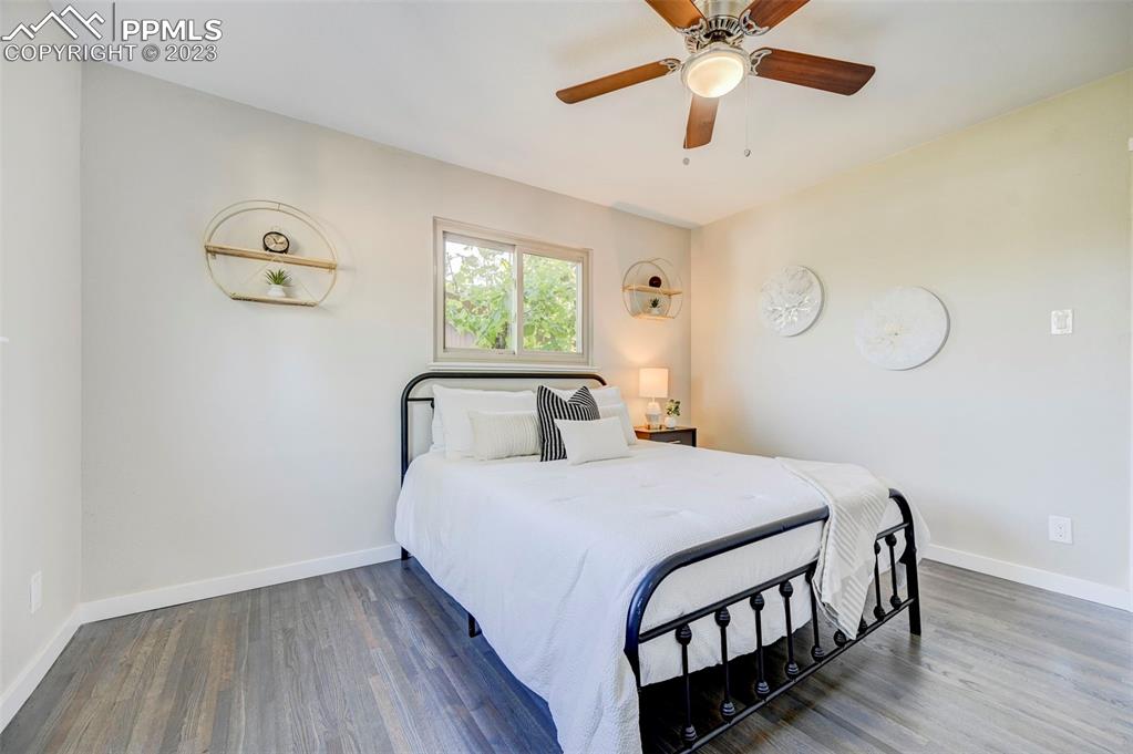 2326 Condor Street Colorado Springs, CO 80909 - Photo 29 of 47 a bedroom with a bed and window