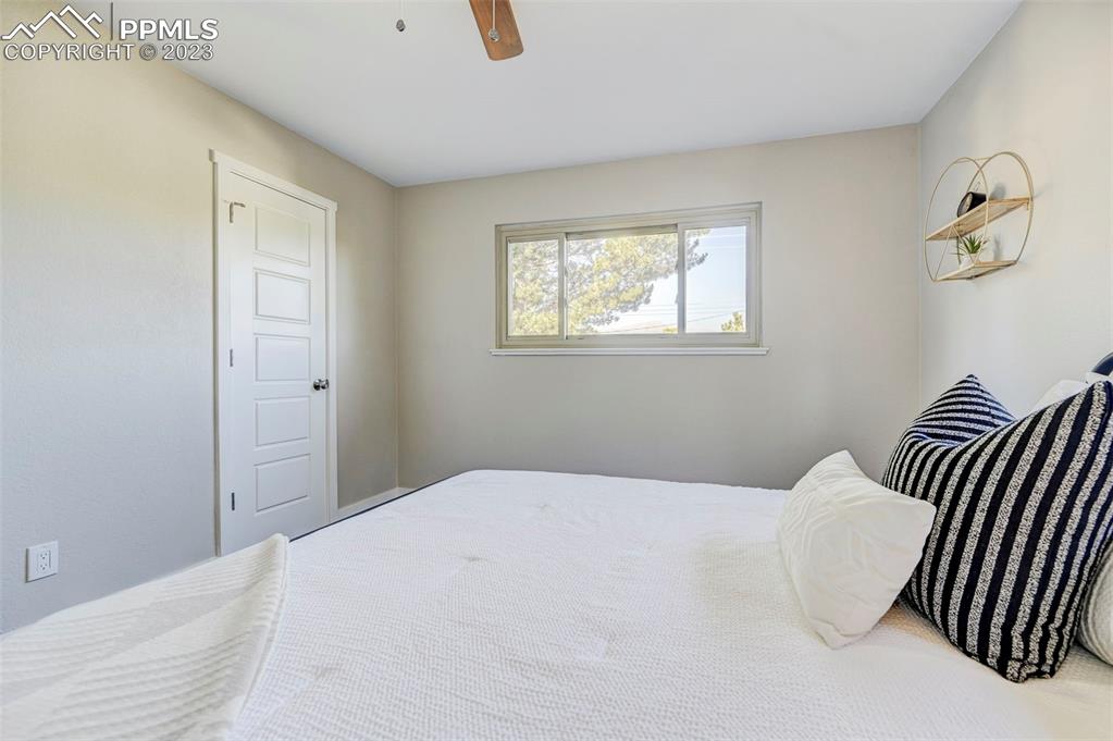 2326 Condor Street Colorado Springs, CO 80909 - Photo 31 of 47 a bedroom with a bed and a window