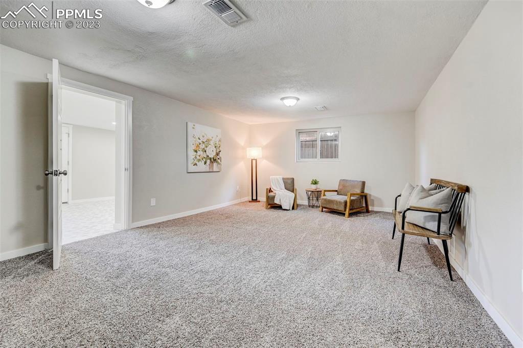 2326 Condor Street Colorado Springs, CO 80909 - Photo 34 of 47 a view of a livingroom with furniture and a couch