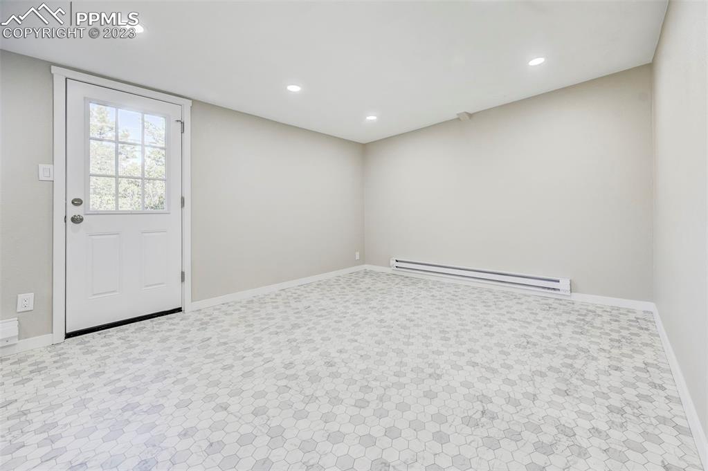 2326 Condor Street Colorado Springs, CO 80909 - Photo 38 of 47 an empty room with windows