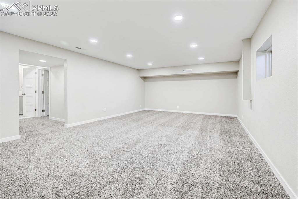 2326 Condor Street Colorado Springs, CO 80909 - Photo 40 of 47 an empty room with a empty space and windows