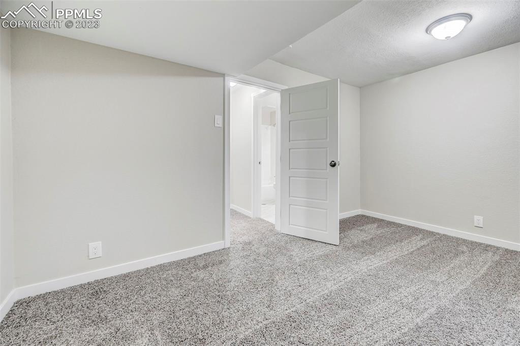 2326 Condor Street Colorado Springs, CO 80909 - Photo 44 of 47 an empty room with an entryway
