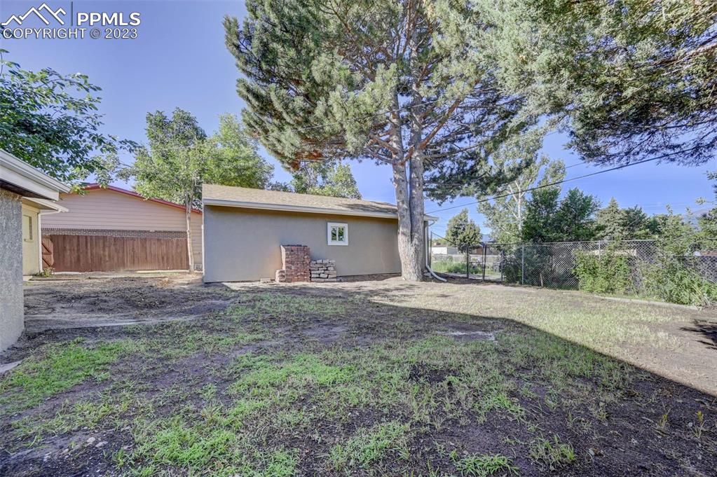 2326 Condor Street Colorado Springs, CO 80909 - Photo 5 of 47 a view of backyard of house with green space