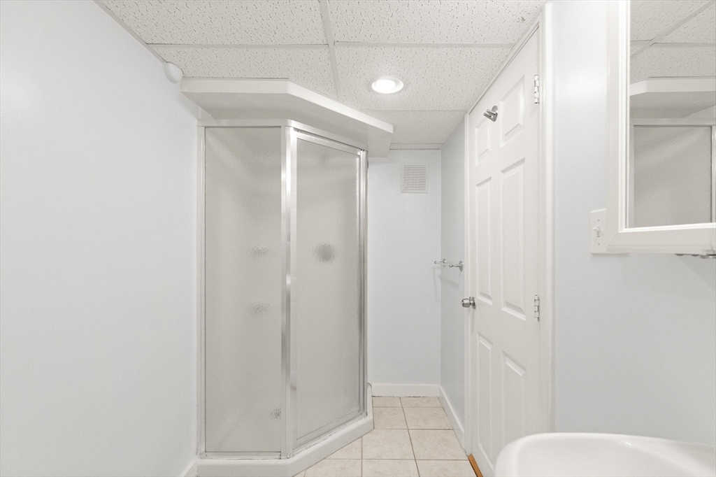 901 Haverhill Street Rowley, MA 01969 - Photo 33 of 42 a bathroom with a shower and toilet