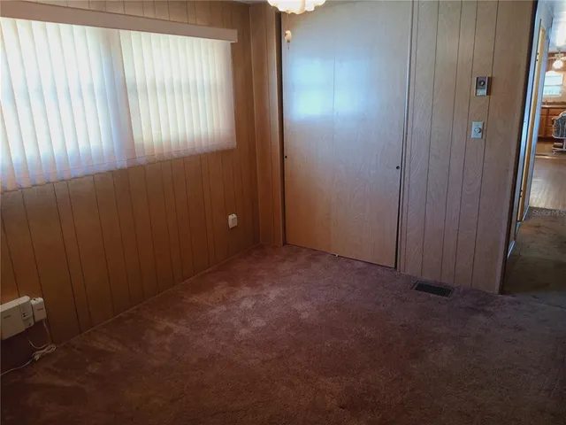 a bathroom with a sink and mirror with toilet
