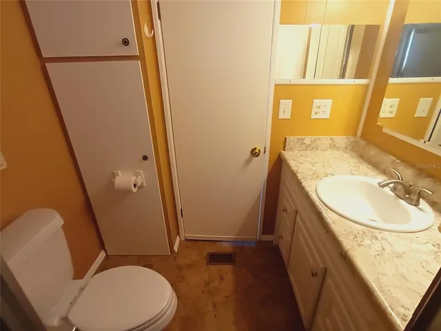 a kitchen with a stove top oven and refrigerator