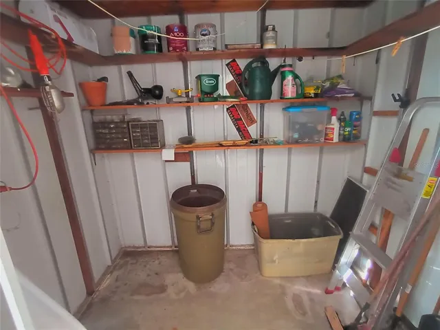 an empty room with furniture and a window