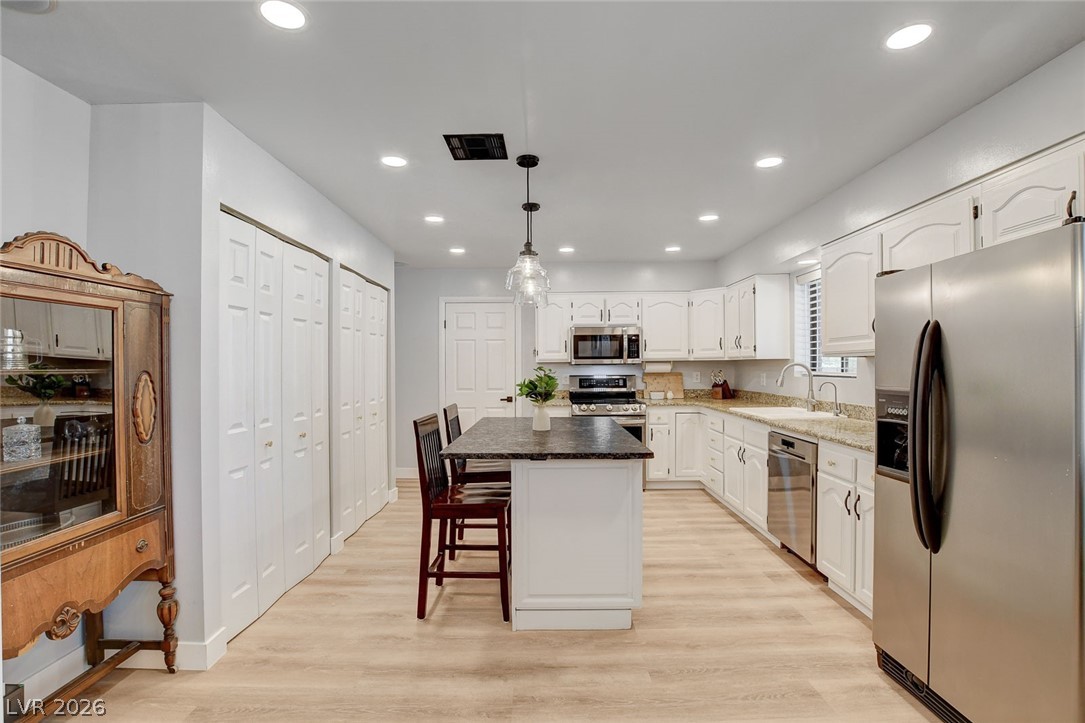 3765 Berkeley Street Logandale, NV 89021 - Photo 4 of 87 This spacious kitchen offers a central island and modern stainless steel appliances.