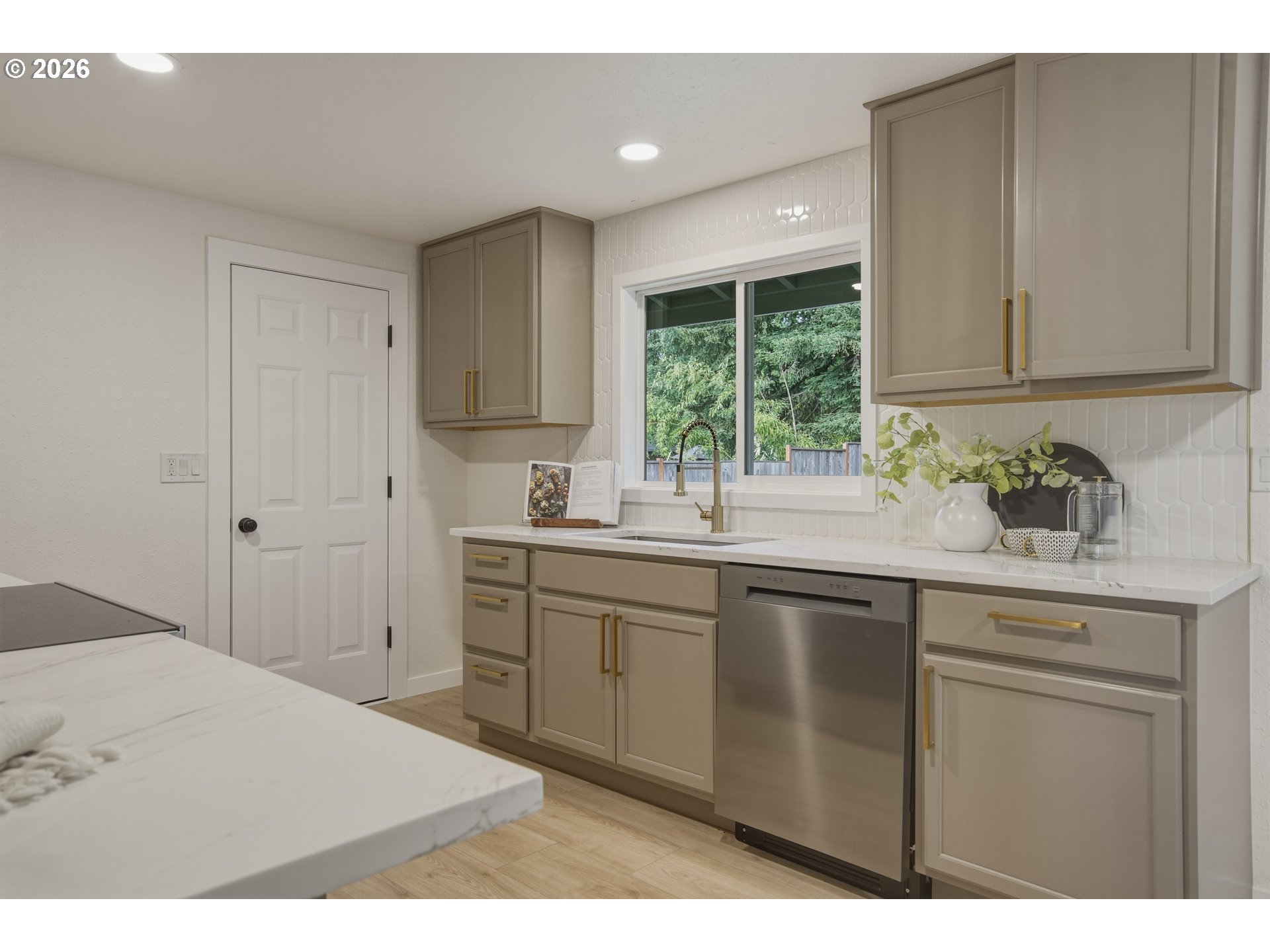 3455 Potter Street Eugene, OR 97405 - Photo 18 of 36 a kitchen with a sink cabinets and window