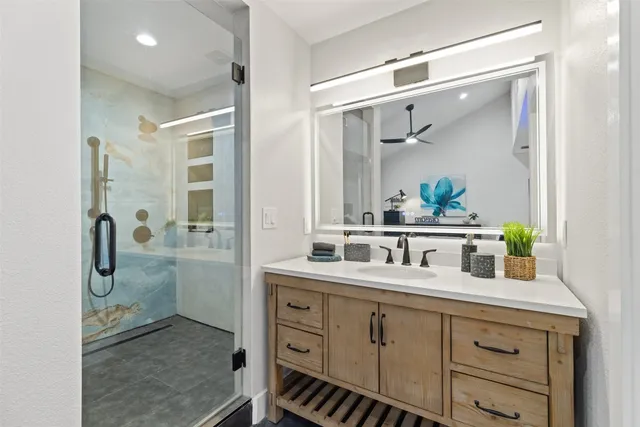 a bathroom with a granite countertop sink mirror and double