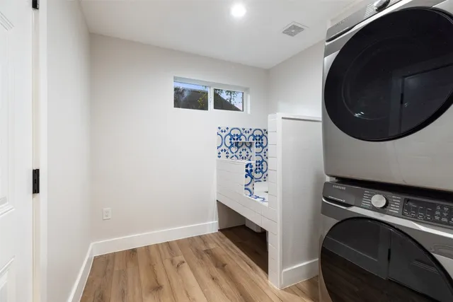 a view of a storage and utility room with washer and dryer