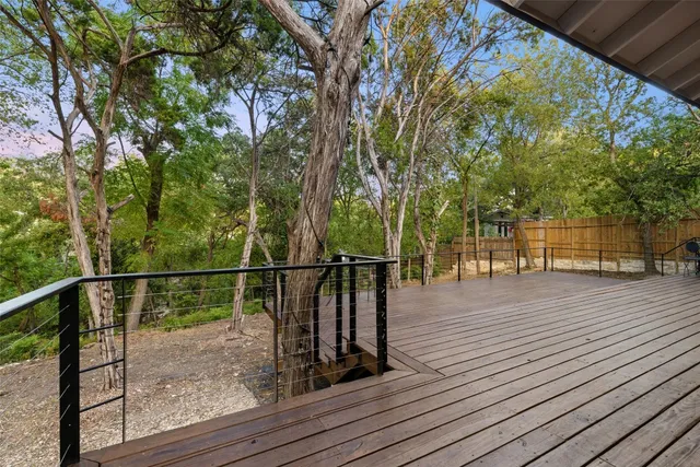a view of a balcony with wooden floor