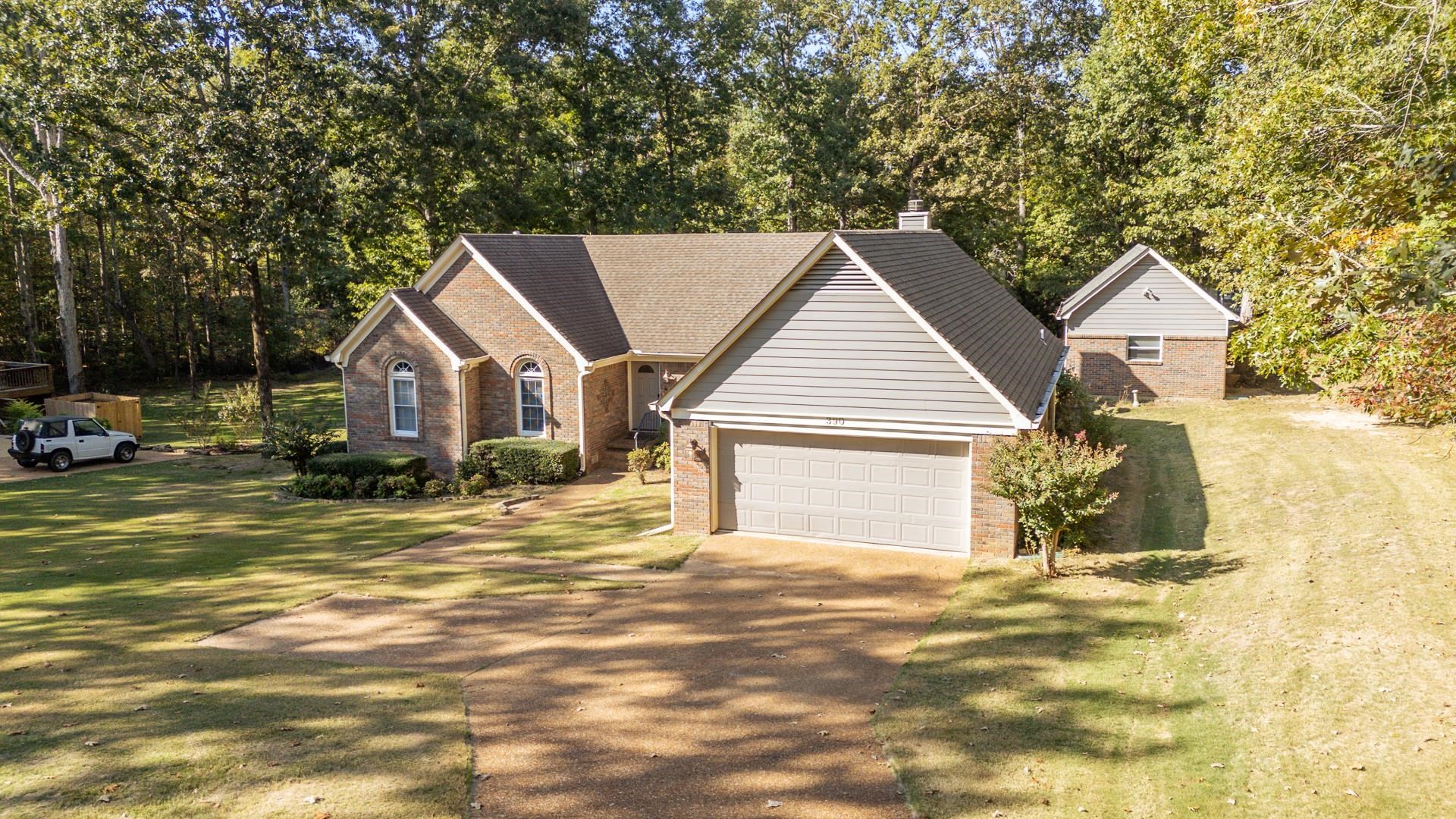 a view of a house with basketball court